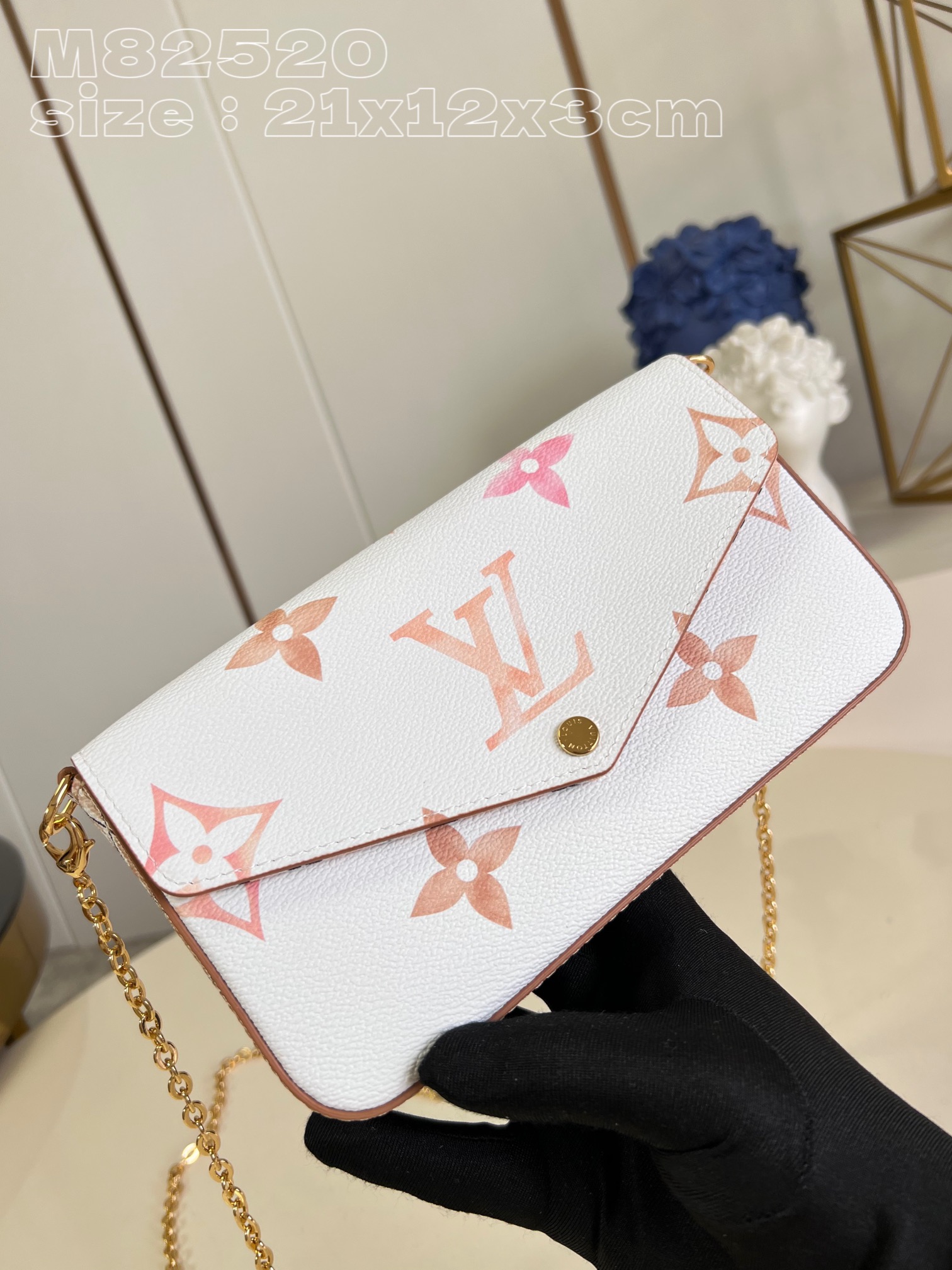 from the current holiday collection, the l0*is V*t0n m82520 pochette félicie chain bag