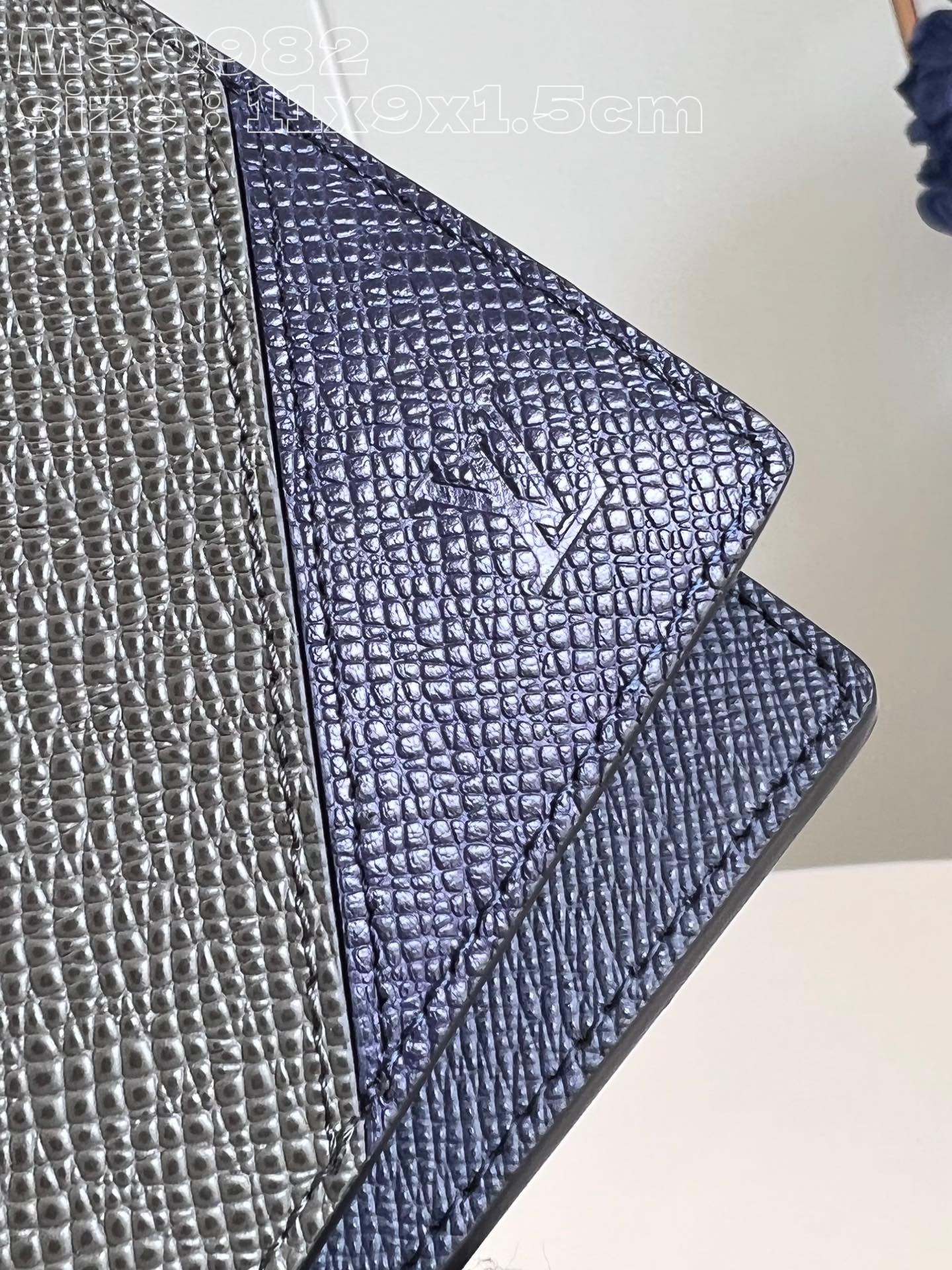 l0*is V*t0n m30982 dark blue multiple wallet in taga cowhide leather is a minimalist design with