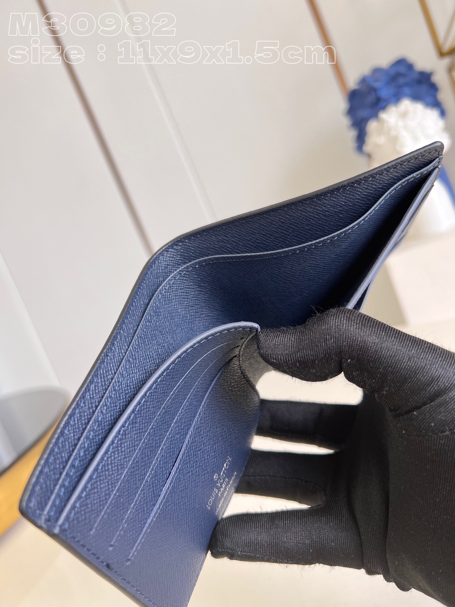 l0*is V*t0n m30982 dark blue multiple wallet in taga cowhide leather is a minimalist design with