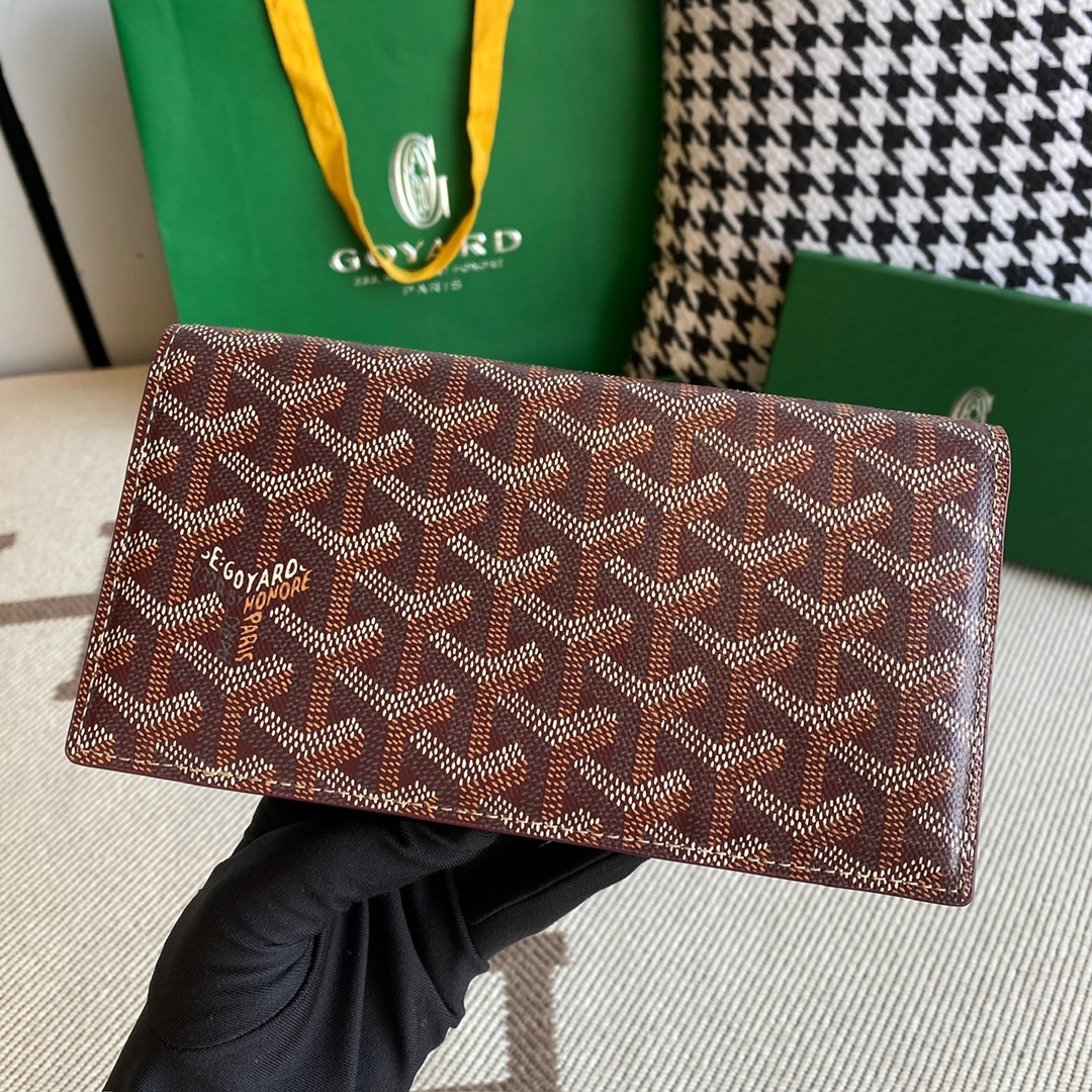 burgundy Go*ard richelieu wallet a long wallet that fastens with a snap fastener