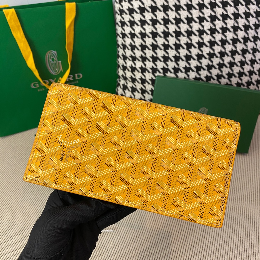 yellow Go*ard richelieu wallet a long wallet that fastens with a snap fastener