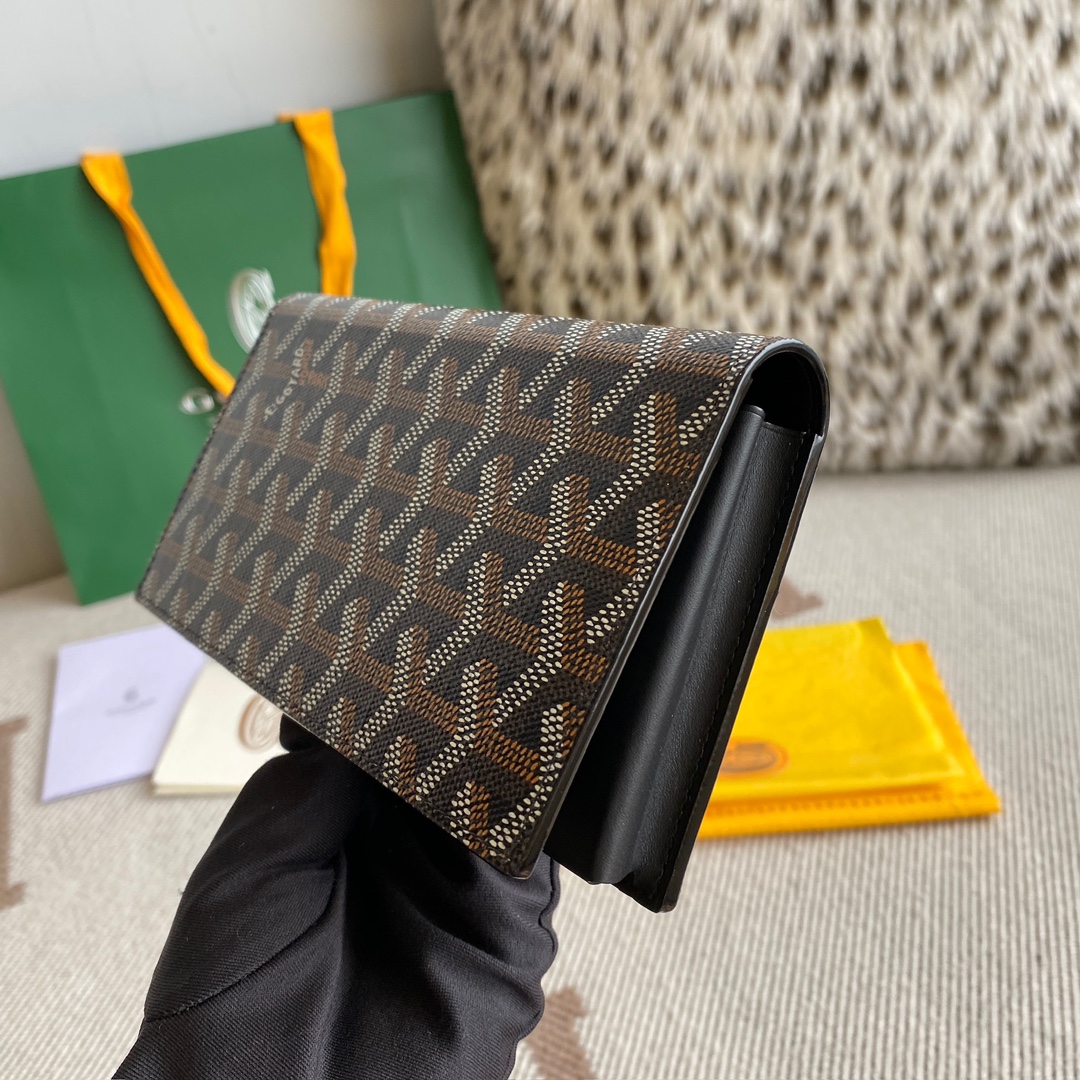 black Go*ard saint-lambert wallet is a universal phone case with all the everyday essentials in one