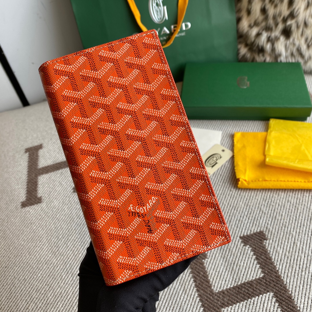 orange Go*ard saint-lambert wallet is a universal phone case with all the everyday essentials in one