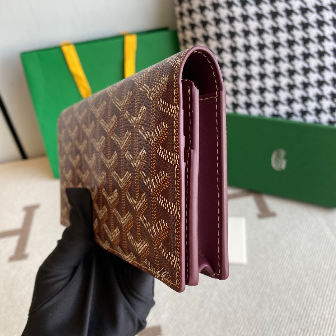 burgundy Go*ard richelieu wallet a long wallet that fastens with a snap fastener