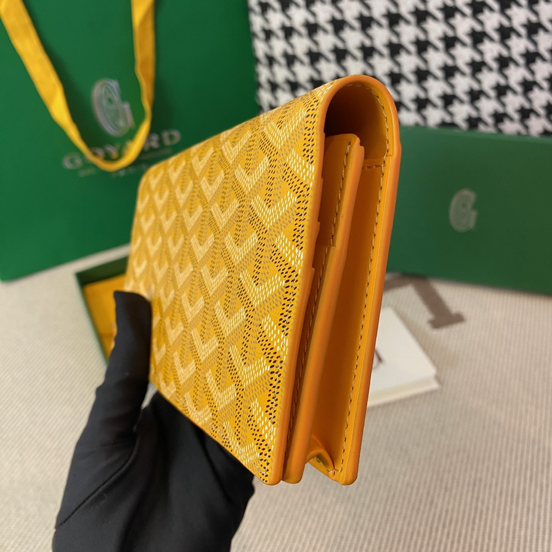 yellow Go*ard richelieu wallet a long wallet that fastens with a snap fastener