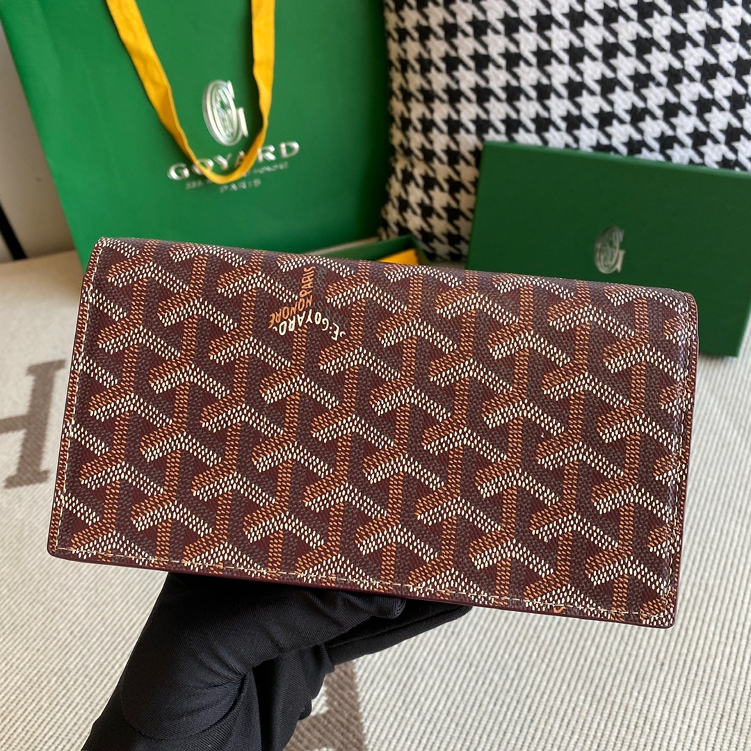 burgundy Go*ard richelieu wallet a long wallet that fastens with a snap fastener