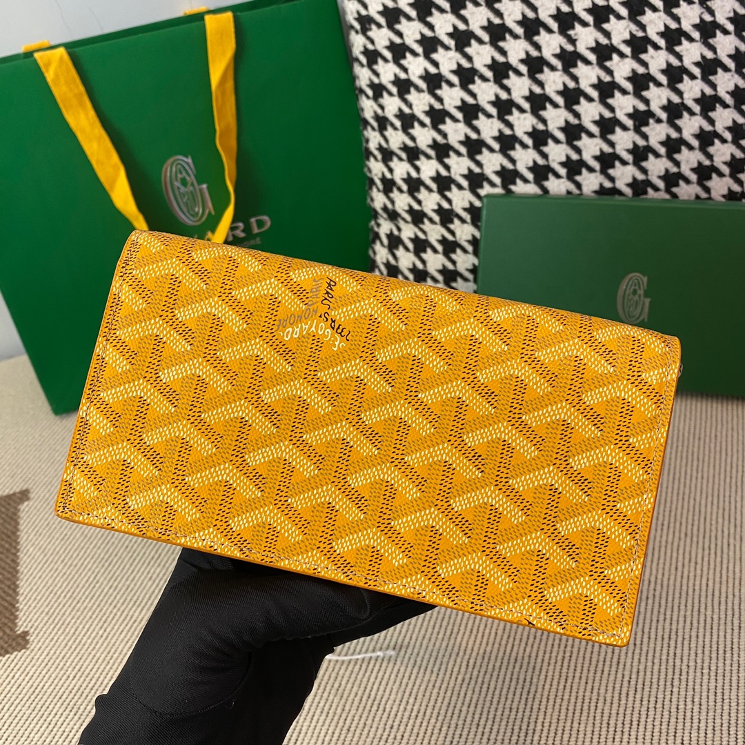 yellow Go*ard richelieu wallet a long wallet that fastens with a snap fastener