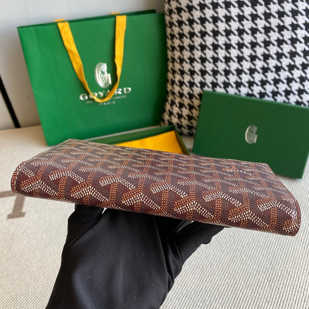 burgundy Go*ard richelieu wallet a long wallet that fastens with a snap fastener