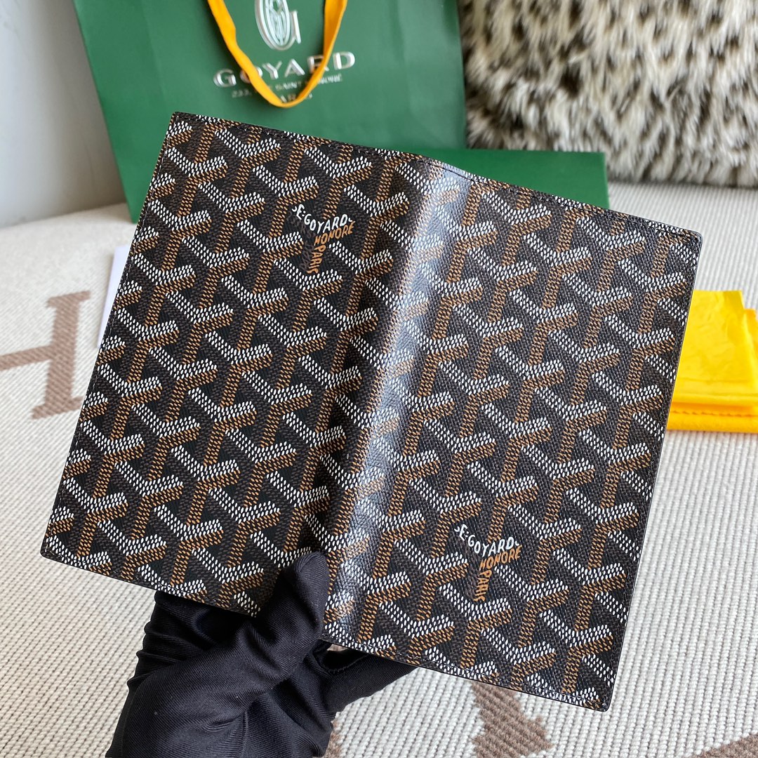 black Go*ard saint-lambert wallet is a universal phone case with all the everyday essentials in one