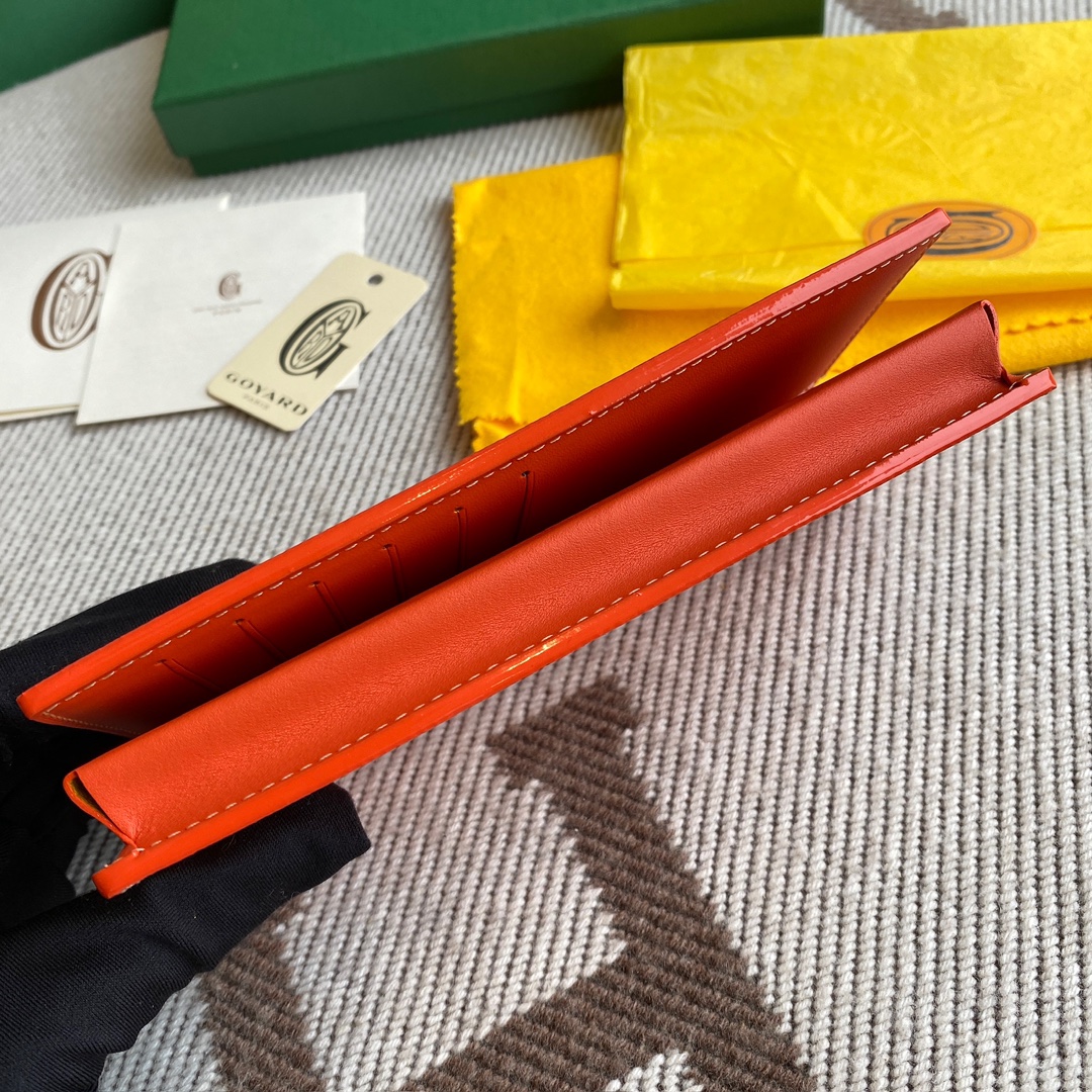 orange Go*ard saint-lambert wallet is a universal phone case with all the everyday essentials in one