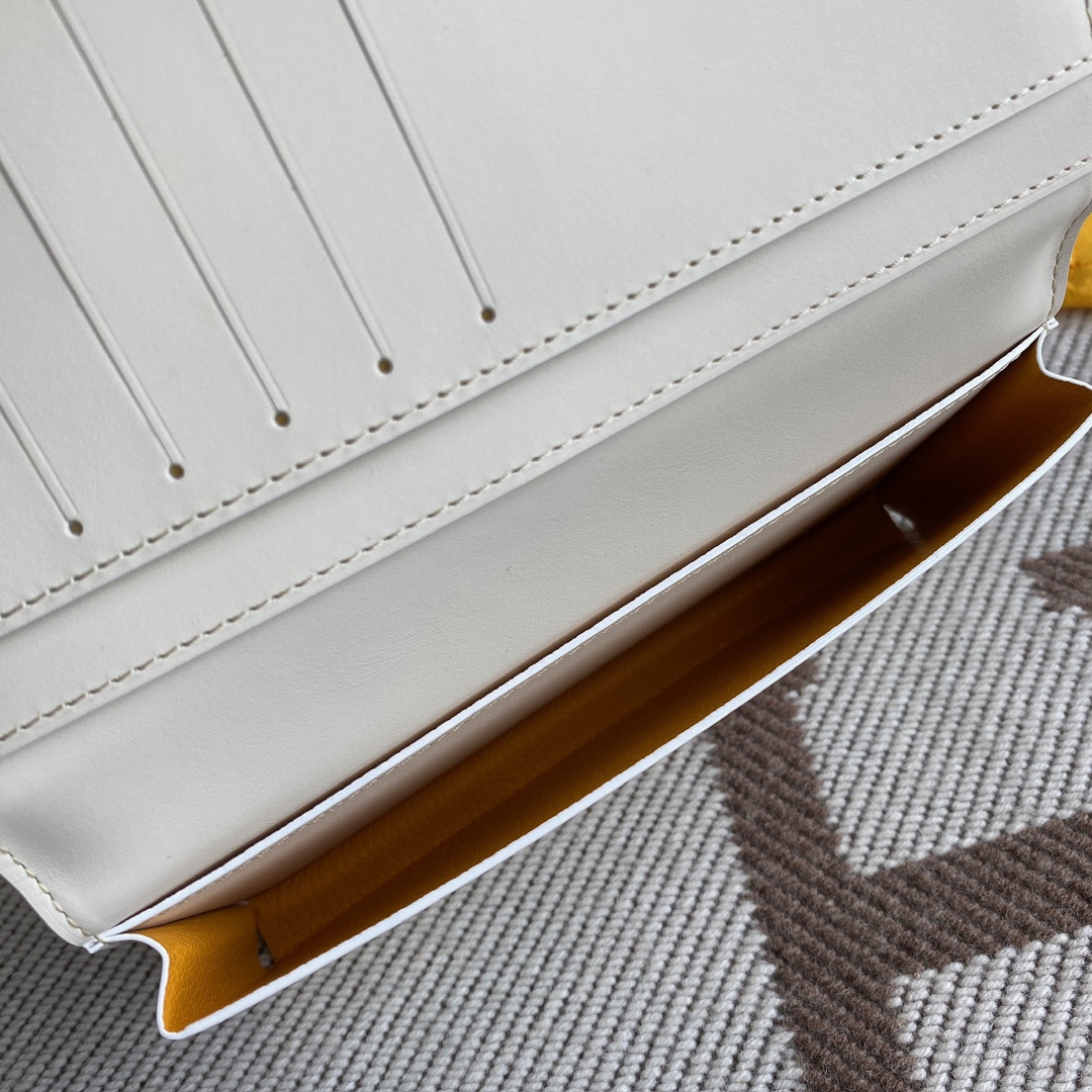 white Go*ard saint-lambert wallet is a universal phone case with all the everyday essentials in one
