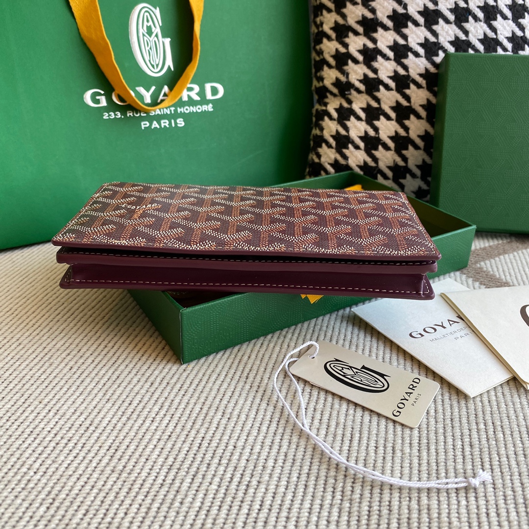 burgundy Go*ard richelieu wallet a long wallet that fastens with a snap fastener
