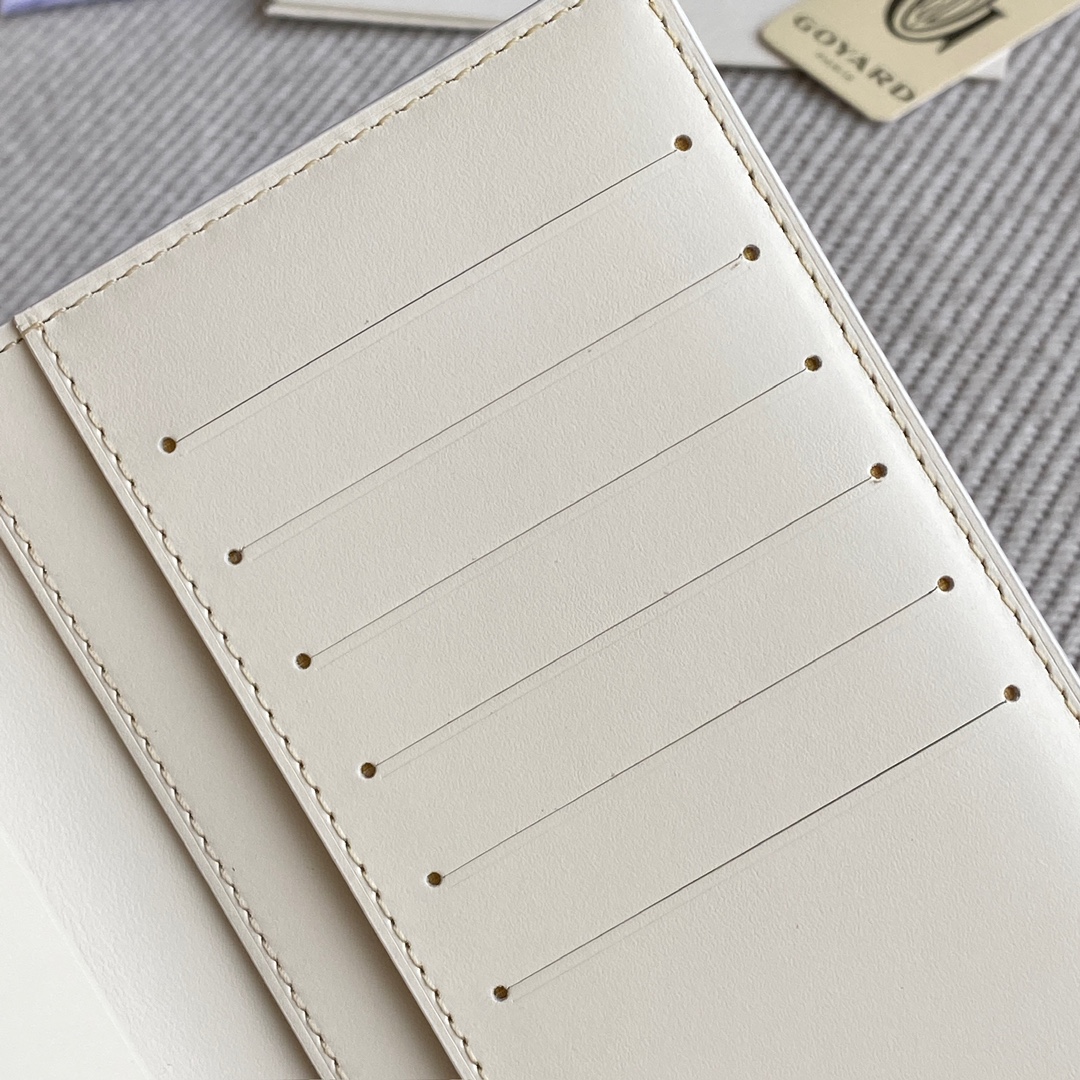white Go*ard saint-lambert wallet is a universal phone case with all the everyday essentials in one