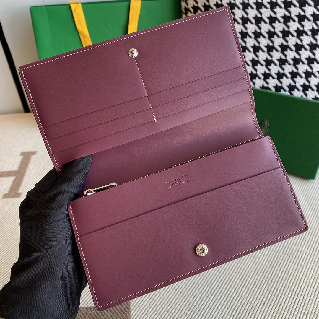 burgundy Go*ard richelieu wallet a long wallet that fastens with a snap fastener