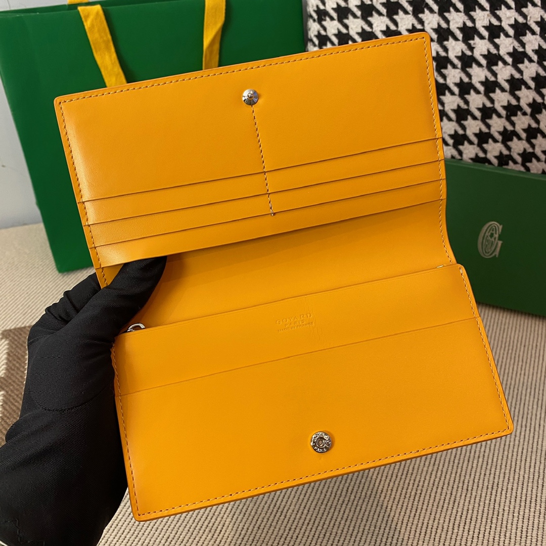 yellow Go*ard richelieu wallet a long wallet that fastens with a snap fastener