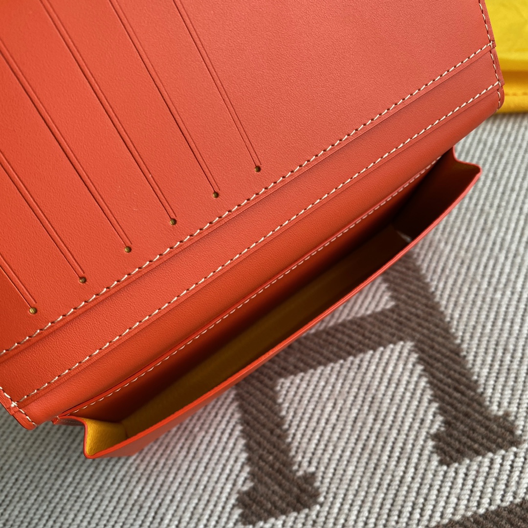 orange Go*ard saint-lambert wallet is a universal phone case with all the everyday essentials in one