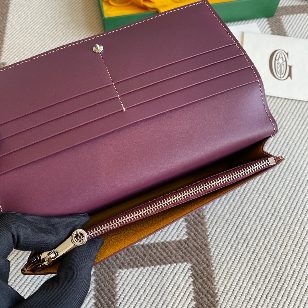 burgundy Go*ard richelieu wallet a long wallet that fastens with a snap fastener