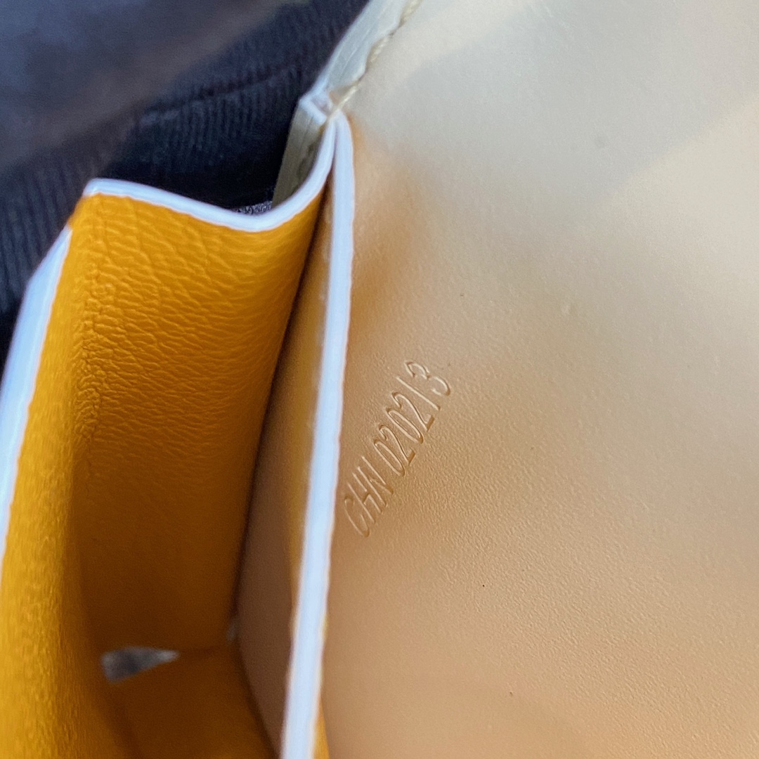 white Go*ard saint-lambert wallet is a universal phone case with all the everyday essentials in one