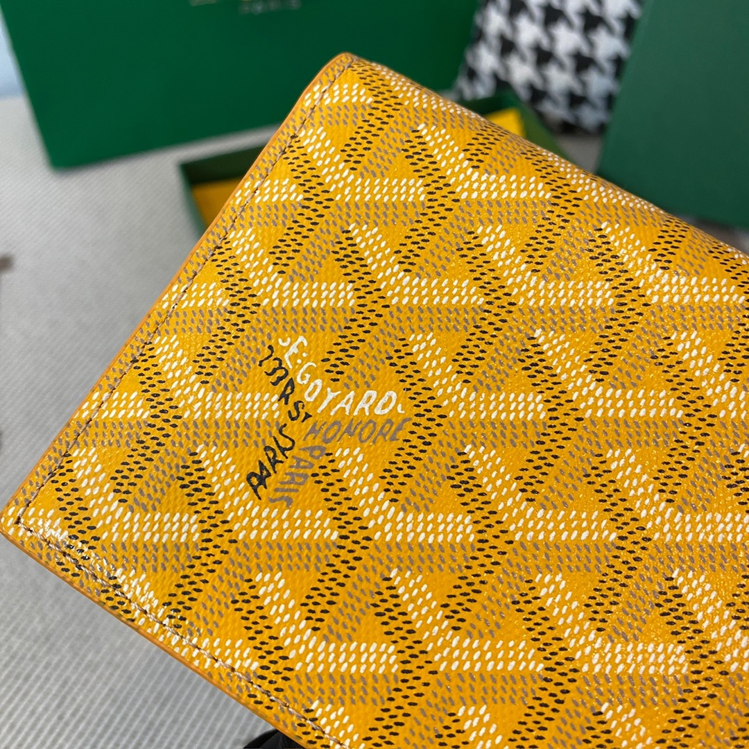 yellow Go*ard richelieu wallet a long wallet that fastens with a snap fastener