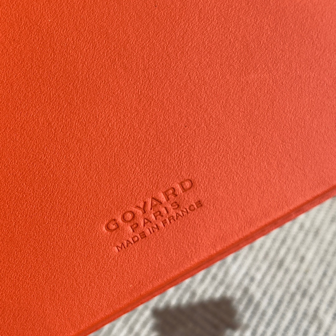 orange Go*ard saint-lambert wallet is a universal phone case with all the everyday essentials in one